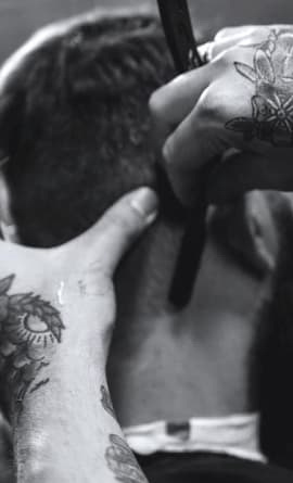 A barber, doing haircut